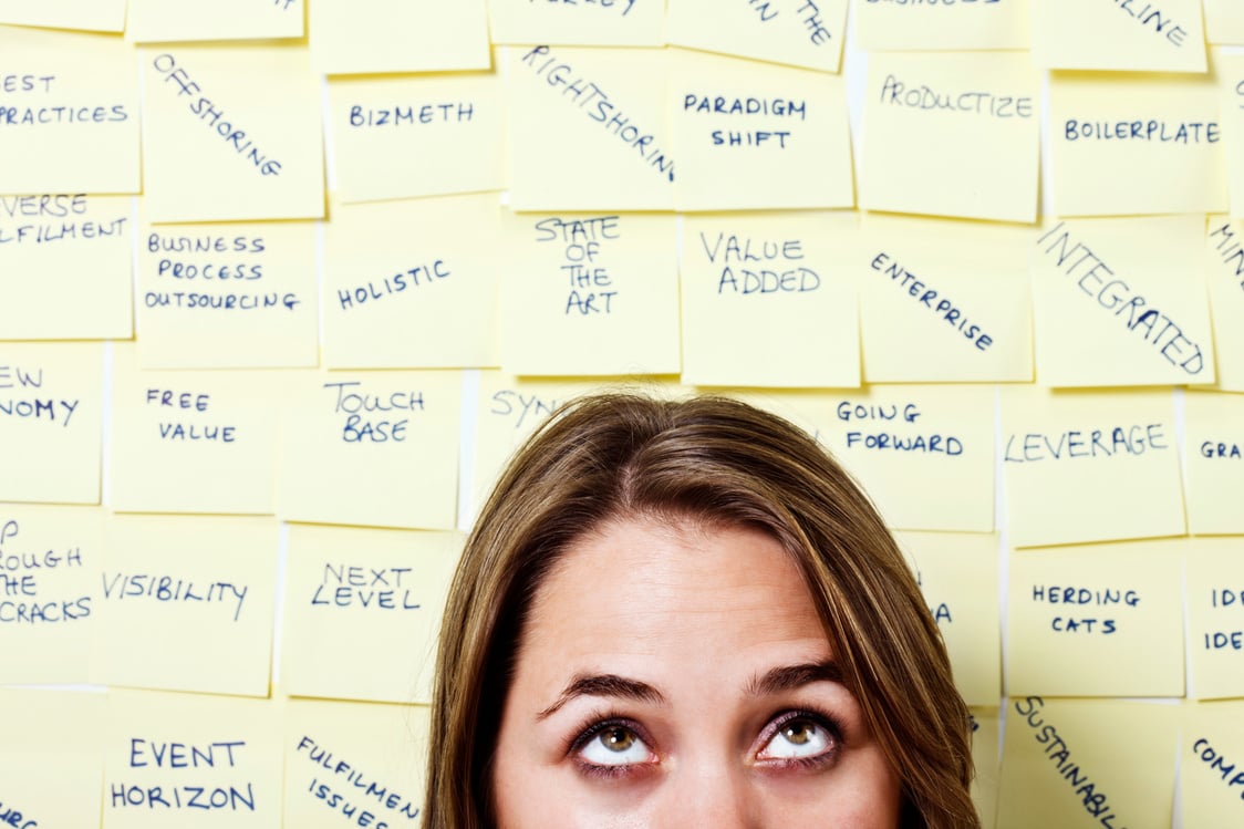 Beautiful young woman rolls her eyes at excess business jargon